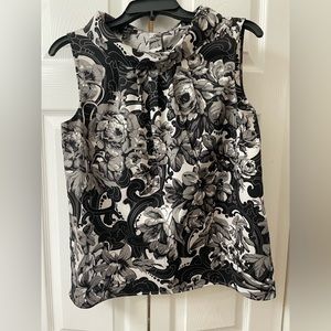 Talbots sleeveless, button up back wide neck blouse.